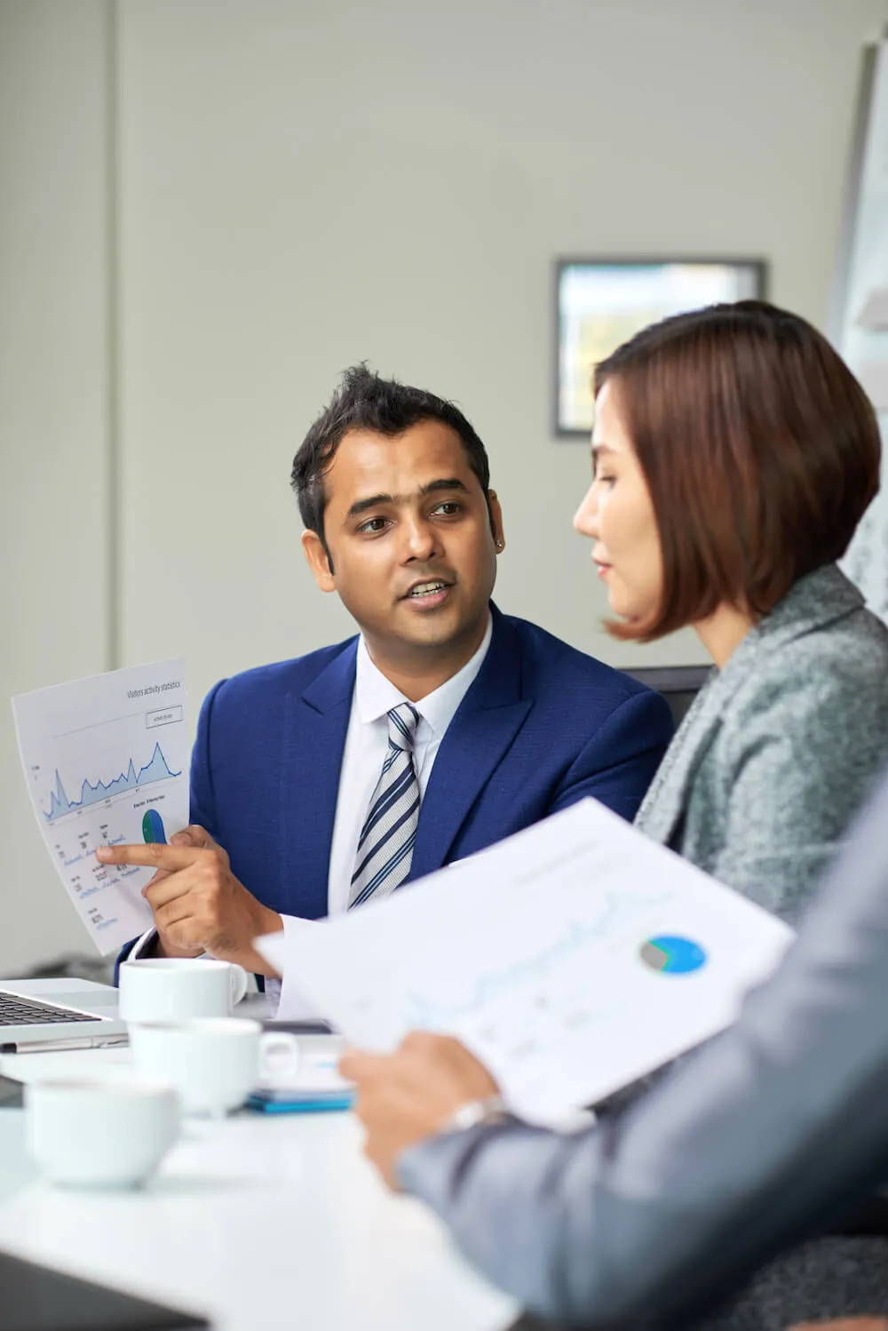 business man pointing to graph