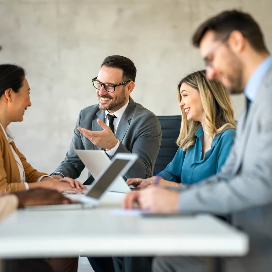 professional business people sitting around a table