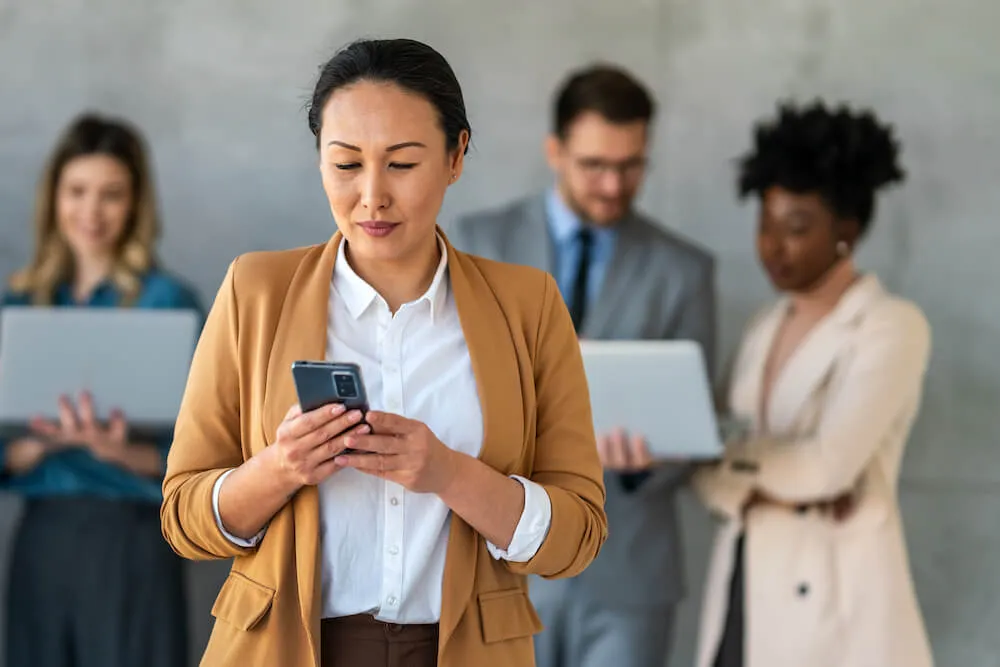 woman looking at cell phone