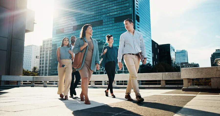 group of people walking into office building