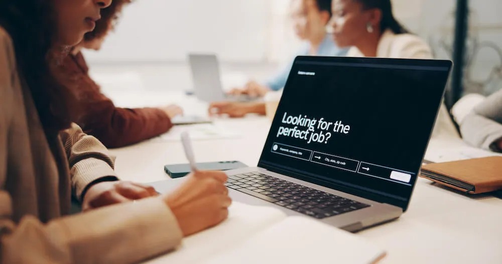 laptop with text that reads: looking for the perfect job?